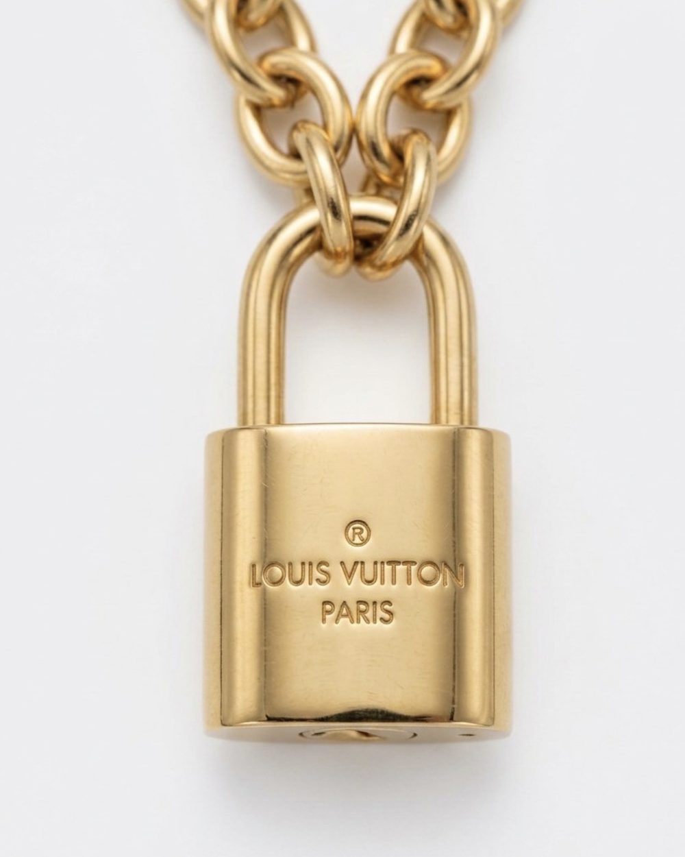 Gold Padlock on chain, charm close-up — Maison Dorée vintage charm necklace