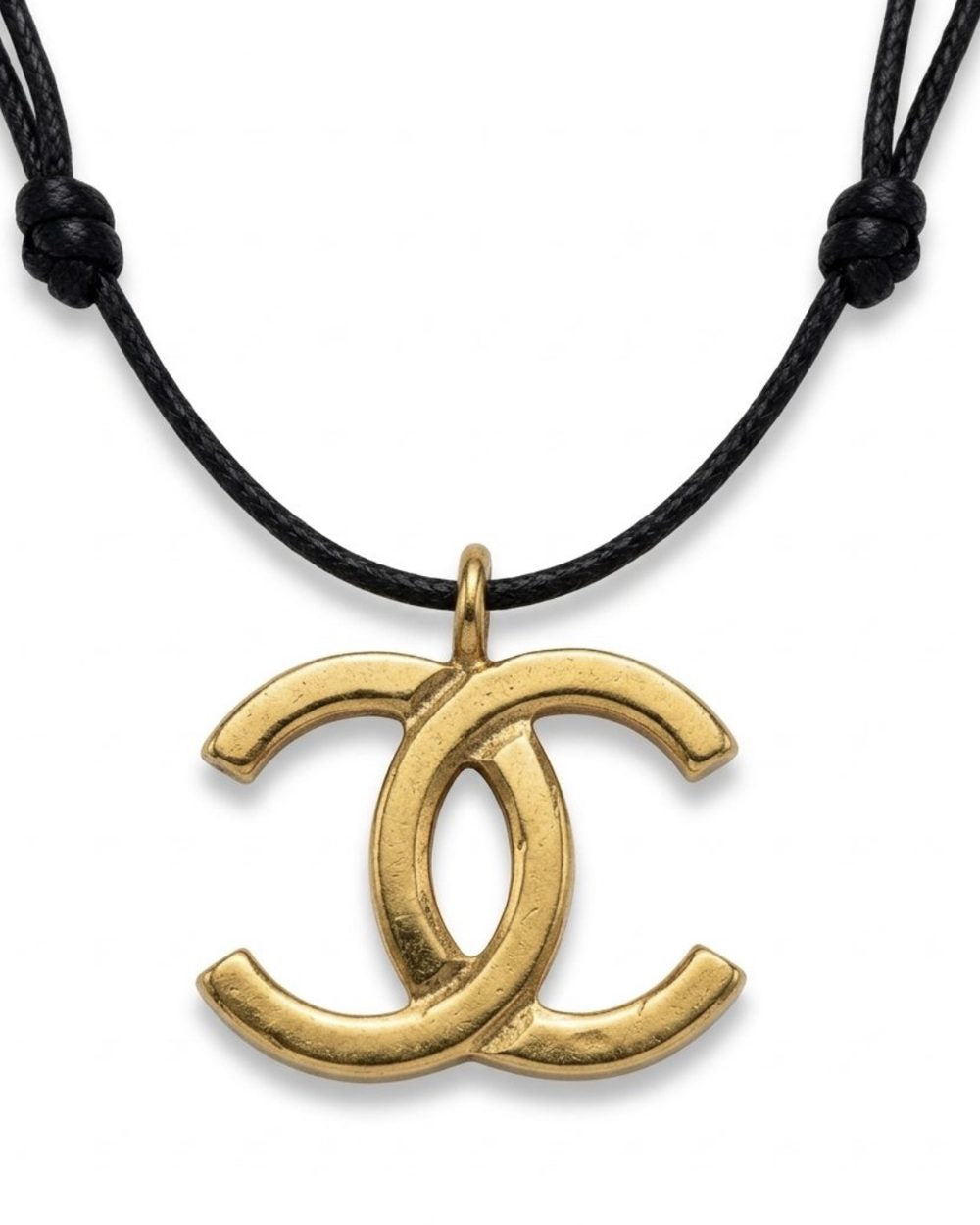 Interlock Pendant on cord, charm close-up — Maison Dorée vintage charm necklace
