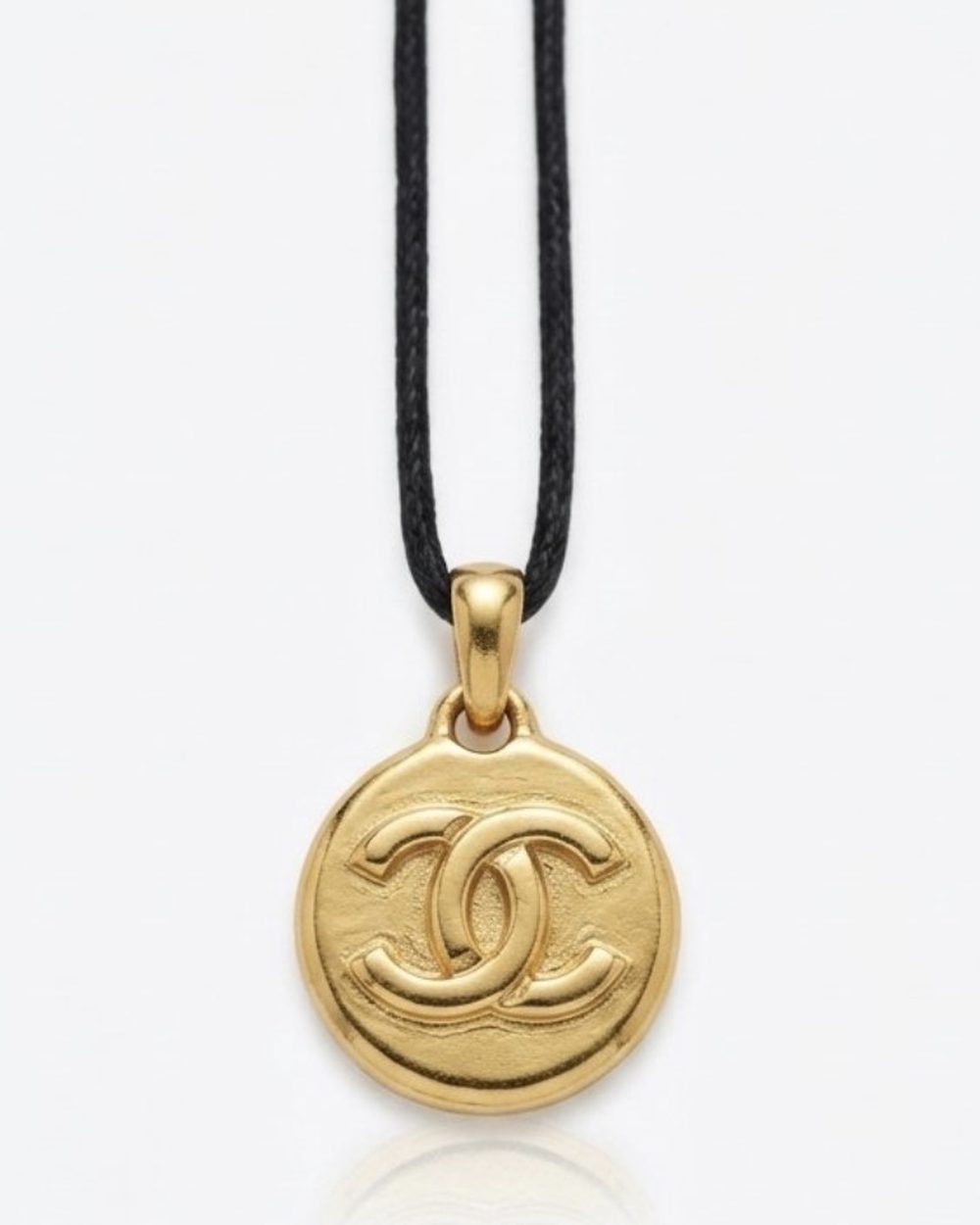 Petite Coin on cord, charm close-up — Maison Dorée vintage charm necklace