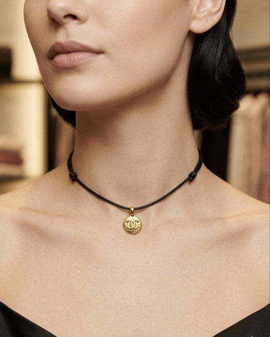 Bail Coin on cord, worn on a model — Maison Dorée vintage charm necklace