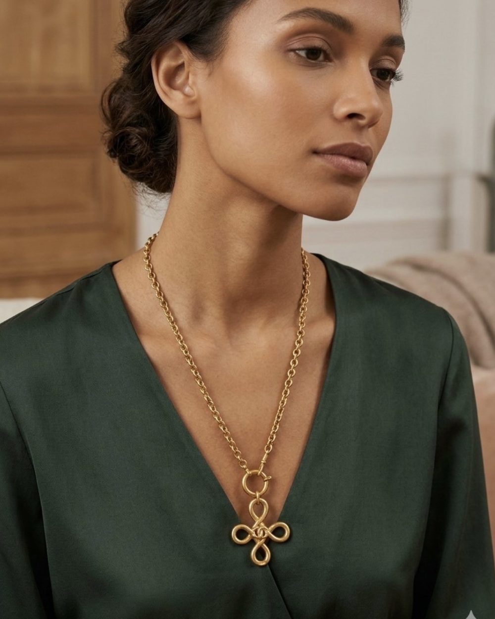 Clover Knot on chain, worn on a model — Maison Dorée vintage charm necklace
