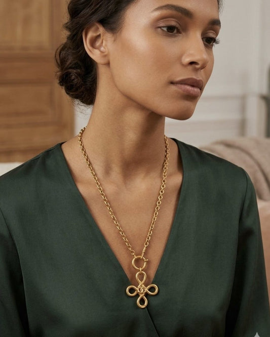 Clover Knot on chain, worn on a model — Maison Dorée vintage charm necklace