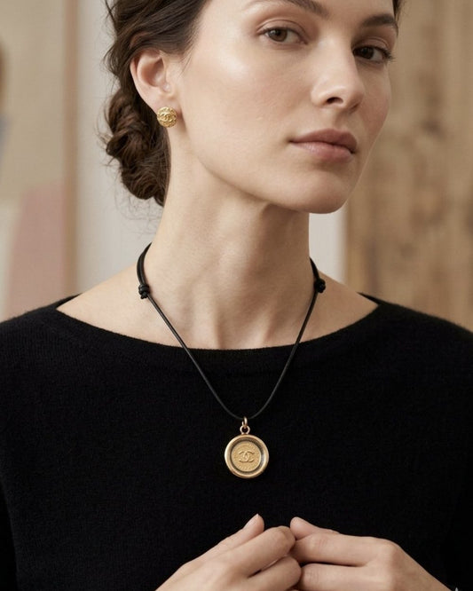 Paris Coin on cord, worn on a model — Maison Dorée vintage charm necklace