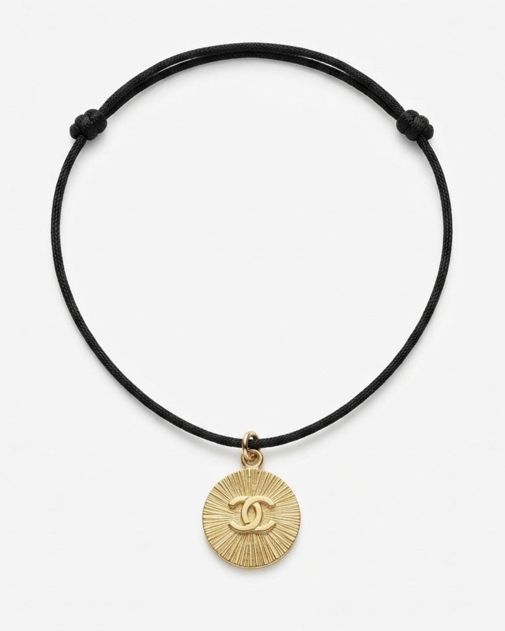 Sunburst on cord, product photo — Maison Dorée vintage charm necklace
